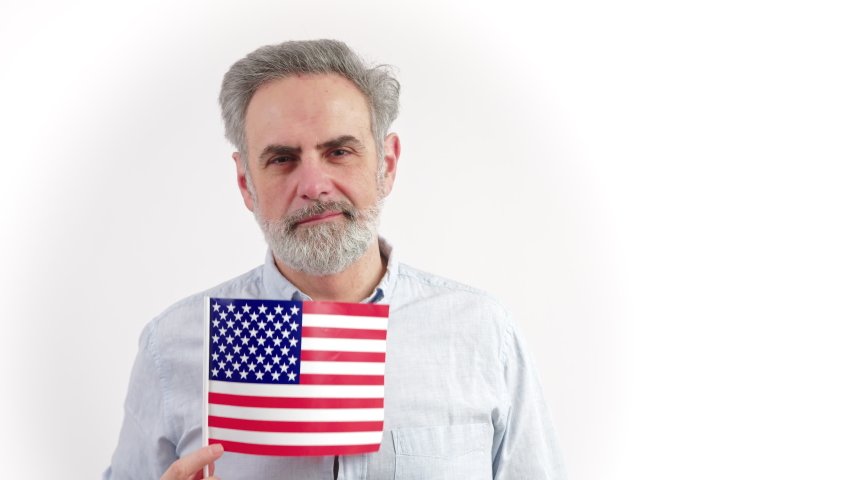 40s caucasian man hiding behing the US flag - portrait isolated on white background. High quality photo