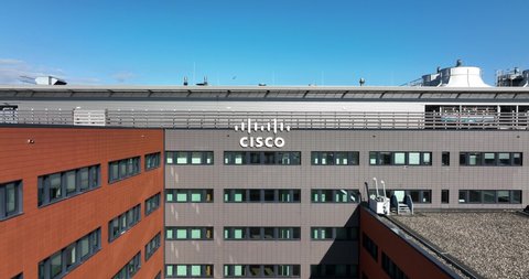 Amsterdam, 6th of March 2022, The Netherlands. Cisco software communication hardware and information technology network provider company logo. Aerial view of an office building facade and logo.