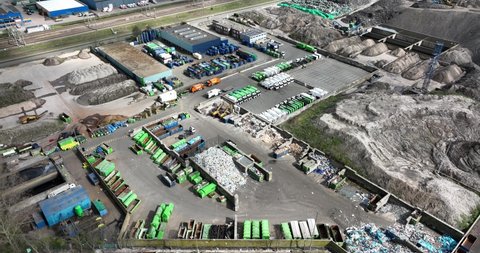 municipality city domestic household garbage trash waste disposal dump recycling and collection center. garbage trucks and containers. Aerial drone view.