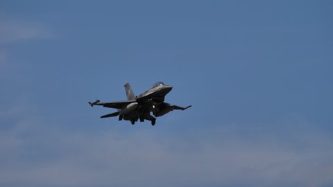 Gran Canaria Spain OCTOBER, 21, 2021 Combat grey aircraft from Greece NATO member landing in blue sky. Lockheed Martin F-16 Fighting Falcon of Hellenic Air Force