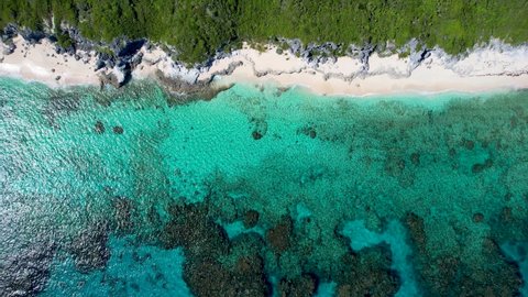 Aerial top down view of the atlantic coast of Long Island, Bahamas, with turquoise sea, beaches and lagoons next to mangrove forest