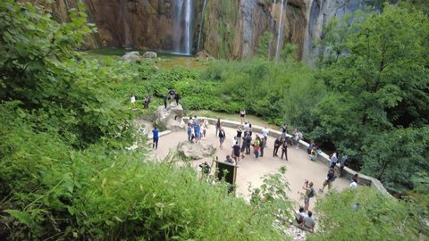 Croatia, Europe - August 2021: the Veliki slap waterfall with tourists in Plitvice Lakes National Park in Croatia in the Lika region. UNESCO World Heritage of Croatia named Plitvicka Jezera.