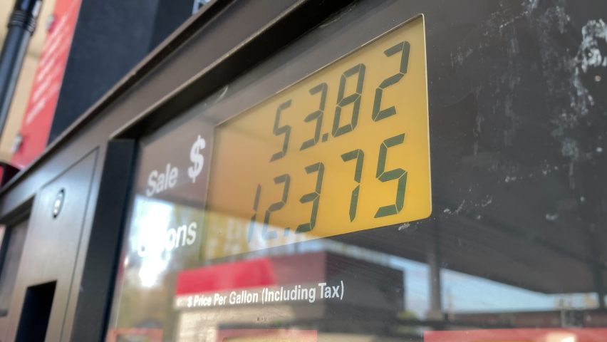 Gas prices close to five dollars a gallon add up quickly at fuel pump, close up point of view. | Shutterstock HD Video #1088996365