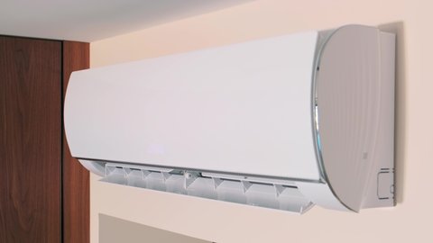 Close Up shot. indoor unit of the air conditioner is attached to wall. Modern air cooling technologies. Turns on, the wing goes down, blinds are opened, drives cold air. Video footage 4k. White design