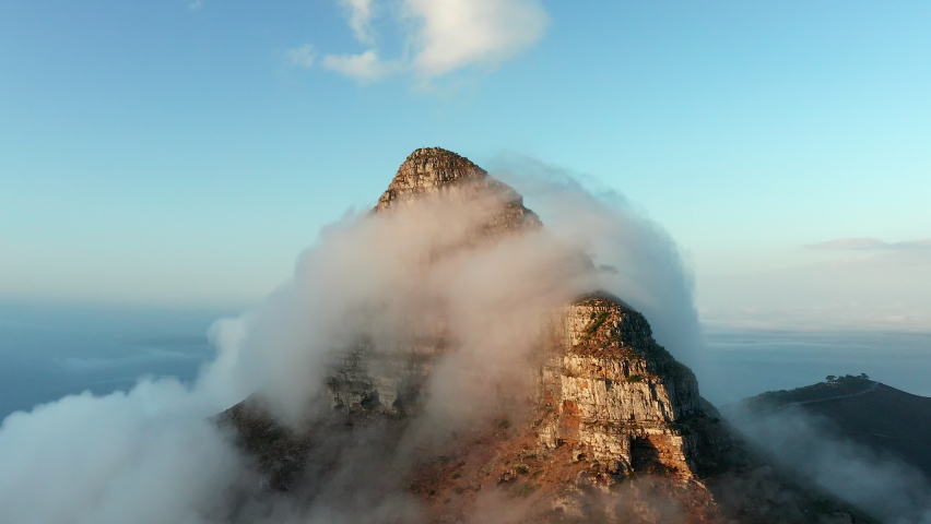 Vivid Clouds Engulfing Lion's Head Mountain In Cape Town, South Africa. Aerial Drone Shot Royalty-Free Stock Footage #1089000677