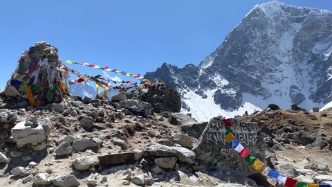 Prayer flags blowing in the wind on the trek to Everest Base Camp in the Himalaya Mountains of Nepal.