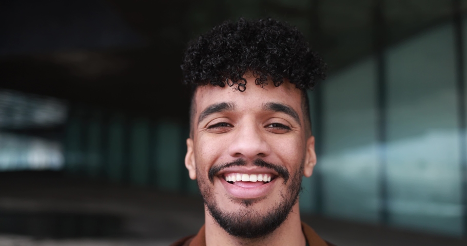Young latin man smiling on camera outdoor | Shutterstock HD Video #1089006789