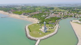 Inscription on video. Italy, Jesolo. Light House Faro di Piave Vecchia. Lido di Jesolo, is the beach area of the city of Jesolo in the province of Venice. Name is burning, Aerial View, Point of inter