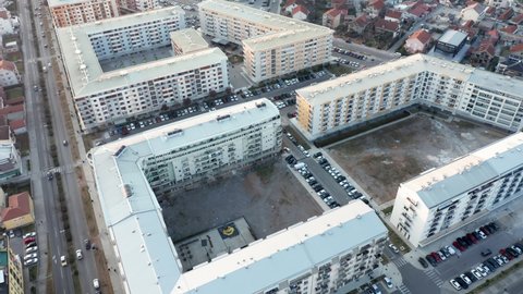 Residential block of high rise apartment buildings made of concrete in a big city in Europe - triangle shaped flat complex in urban environment. Aerial drone view of Podgorica Montenegro, Mar 25.2022