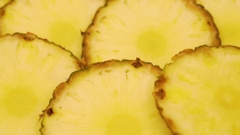 Ripe Slices of Pineapple, Tropical Fruit, Closeup. Healthy Vegan Food Concept. Rotation Isolated Slices of Fresh Pineapple.