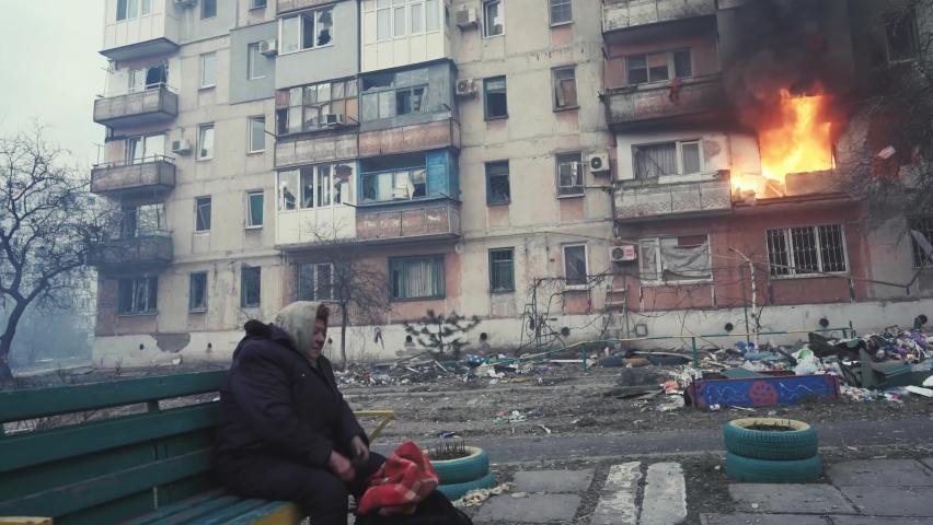 Bucha, Kyiv, Ukraine - 04.04.2022: Terrible footage of the war in Ukraine. Aftermath of the bombing. Unhappy woman crying.