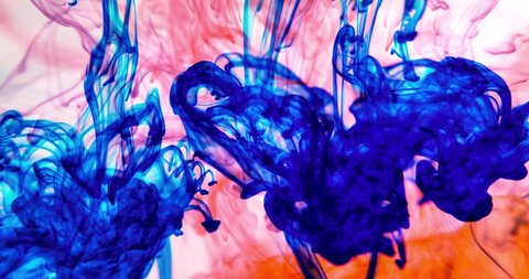 Colored splashes in abstract shape, color ink dropped. Colour fluid liquid. Acrylic colour paint in water. Art wallpaper with fluid smoke. CMYK.