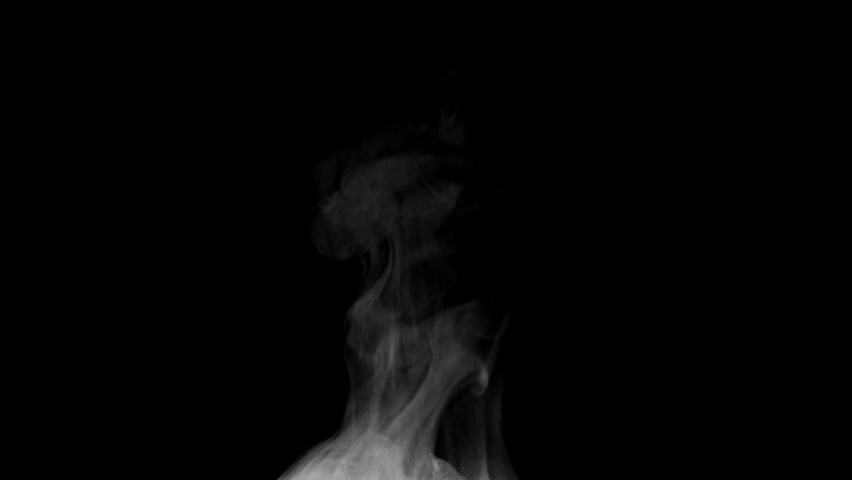 Steam for Food. White steam spins and rises from the pan. White smoke rises from a large pot, which is located behind the frame. Isolated Steam seamless loop black background.