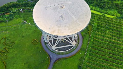 Aerial footage of astronomical radio telescope. Radio telescopes are used in science for space observation and distant objects exploring.