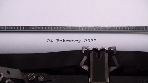 Typing phrase "24 February 2022" on retro typewriter.