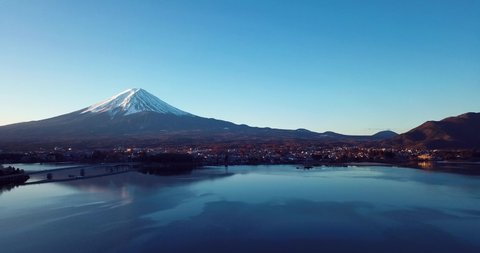 Aerial View to the Blue Sky and Sunrise Lights on the Sacred Fuji Mount, Japan