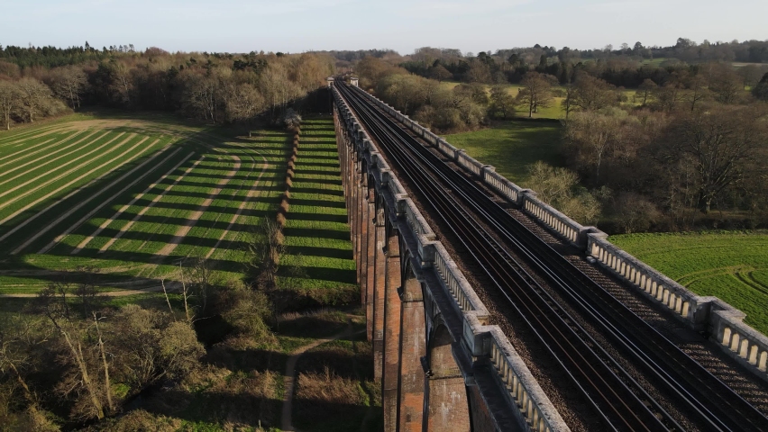 London-Brighton Railway Line on the Ouse Valley Viaduct at sunset - Aerial Royalty-Free Stock Footage #1089030787