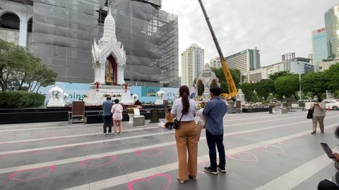 BANGKOK, THAILAND - Circa November, 2021: Ganesha Shrine at Central World Shopping Plaza Complex, famous tourist attraction on Ratchadamri Road. New shopping mall under construction in background