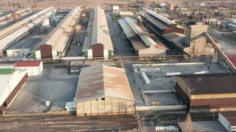 Industrial halls in a metal factory -  large manufacturing plant for electrolysis and aluminum production. Aerial drone view.