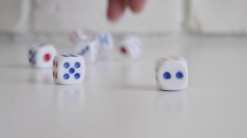 Blurred Shooting with a  Person Playing a Game with Dices. Gambling, Betting and Winning. 