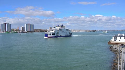 Portsmouth, Hampshire, UK, March 17, 2022, Wightlink ferry St Clare departs from Portsmouth Harbour with Gosport in the background.