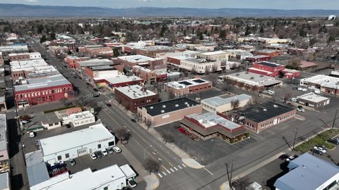 Cinematic 4K aerial drone dolly in shot of old buildings in the city of Ellensburg downtown, Kittitas County in Western Washington