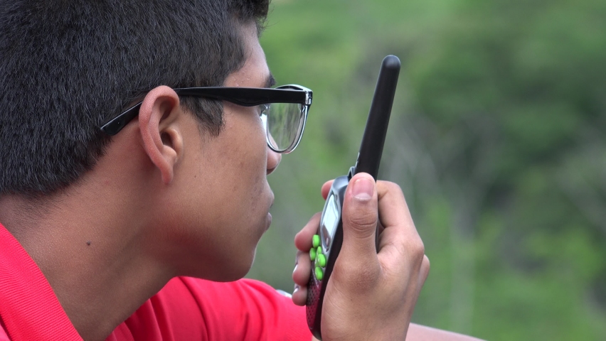 A Boy Talking On Walkie Talkie