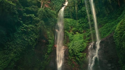Waterfall in green rainforest. Aerial view of triple waterfall Sekumpul in the mountain jungle. Bali,Indonesia. Travel concept. Aerial footage.