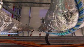 Steel pipe management for network or electric cable with metal flex pipe or conduit timelapse hyperlapse. Corridor between electricity control room and server hardware in data center - Powered by Shutterstock - Get 15% off with code: PIKWIZARD15