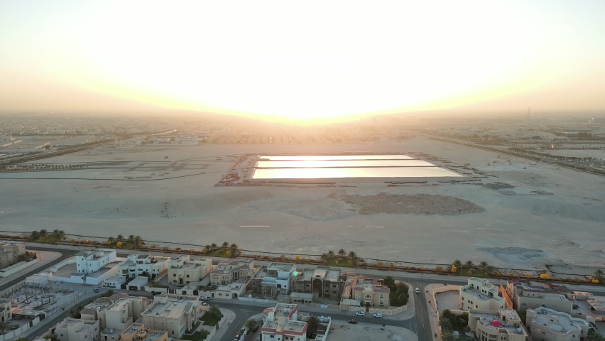 Doha, Qatar: Aerial view of capital city of Qatar, outskirts of city with adjoining desert - landscape panorama of Arabian Peninsula from above, West Asia