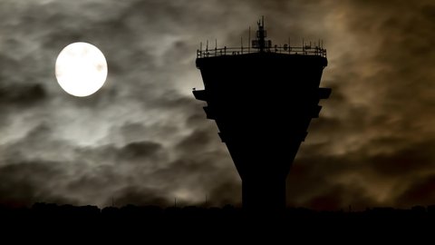 Air Traffic Control Tower by Night with Dark Atmosphere, Fog, Smoke, and Full Moon