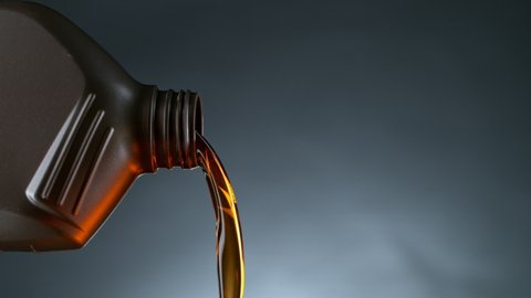 Super Slow Motion Shot of Pouring Oil from Plastic Container at 1000 fps.