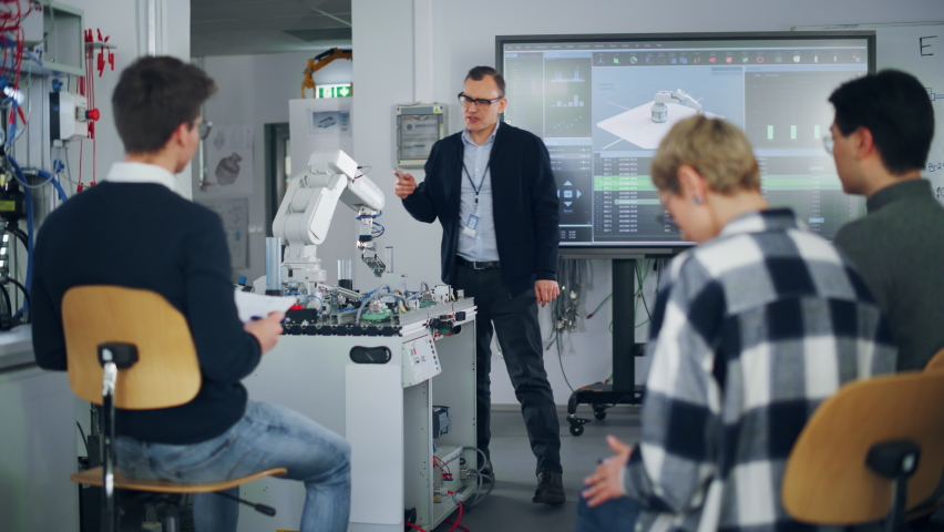 University Robotics Class. White Male Teacher Explaining Engineering to Students Using Robot Arm. Diverse Group of Young Engineers Sitting at University. Computer Science Education Build, Design - Powered by Shutterstock - Get 15% off with code: PIKWIZARD15