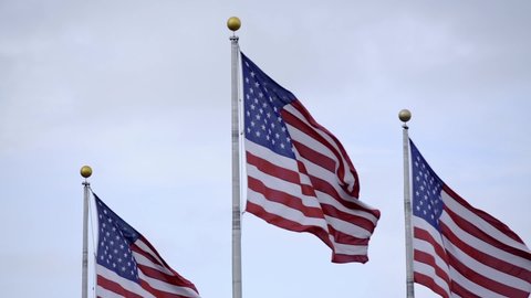 United States of America flags in slow motion. Flag Plaza in New Jersey. USA flags flying in the wind