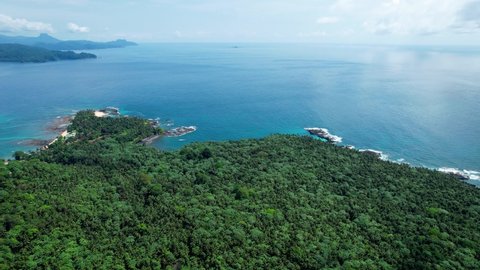 Aerial drone view over the Ilheu das Rolas island, in sunny Sao Tome and Principe