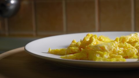 Close-up View of Delicious Scrambled Eggs on a Plate - Truck Shot