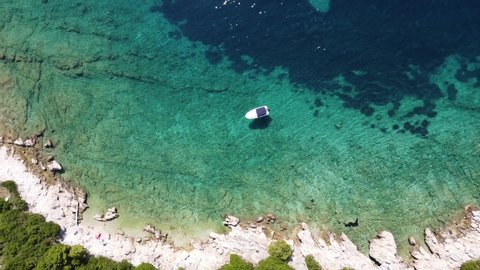 Aerial Drone View (Overhead - Top Down) of a Boat and Turquoise Crystal Clear Adriatic Sea - Krk Island, Kvarner, Croatia
