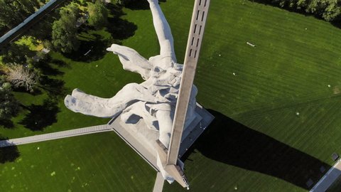 Close-up drone view of the epic famous Soviet sculpture The Motherland Calls. Historical memorial. The statue is an allegorical image of the Motherland - JULY 08, 2021 Volgograd, Russia