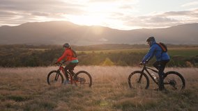 Side view of active senior couple riding bikes outdoors in forest in autumn day. - Powered by Shutterstock - Get 15% off with code: PIKWIZARD15