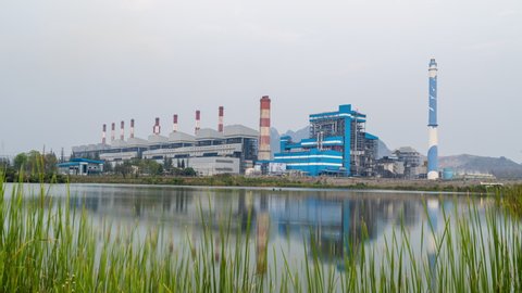 Lampang, Thailand - March 15, 2022 - Timelapse view of the Mae Moh power plant in Lampang, Thailand on the evening of March 15, 2022
