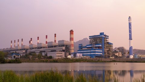 Lampang, Thailand - March 15, 2022 - Timelapse view of the Mae Moh power plant in Lampang, Thailand on the evening of March 15, 2022