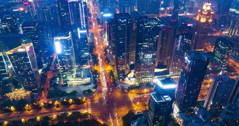 Aerial hyper lapse of Chengdu Cityscape at twilight  with buildings and traffic on the road Chinese word means China Chengdu