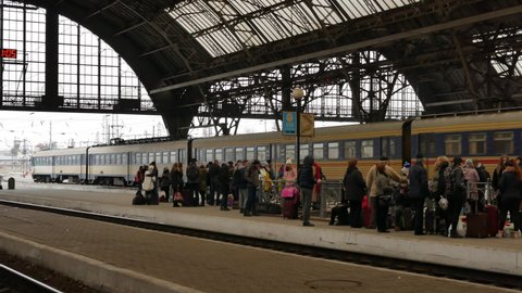 LVIV, UKRAINE - JANUARY 5, 2018: Train departures from Lviv railway station in Ukraine. 4K, Editorial, Handheld. Contains audio