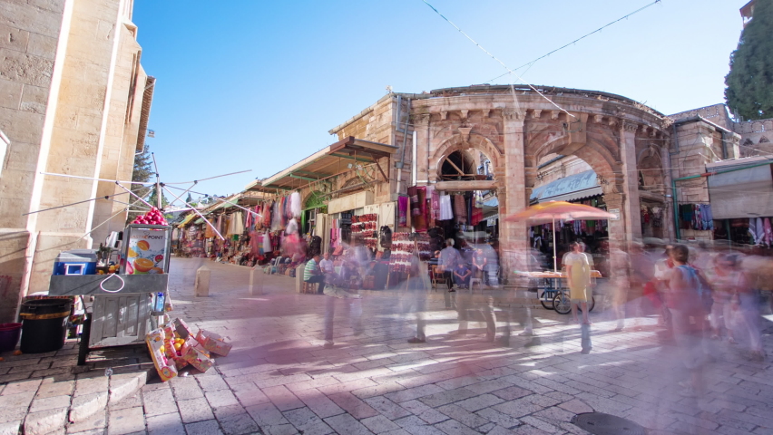 The colorful souk near church in the old city of Jerusalem Israel timelapse hyperlapse. People passing by on this makret