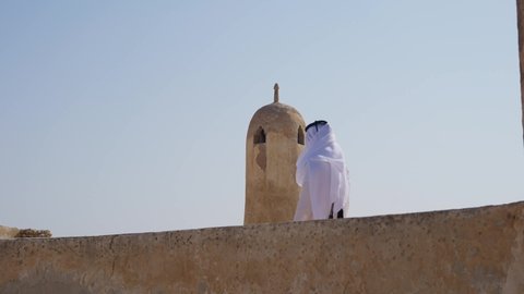 Qatari man with traditional clothes at Al Jumail village at Qatar
