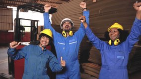 Showing teamwork in the factory . Industrial people and manufacturing labor concept .Asian ,African Woman and man engineer action very happy of their sucessful . - Powered by Shutterstock - Get 15% off with code: PIKWIZARD15