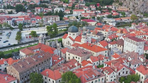 Kotor, Montenegro. church of Sveti Nikola is a Serbian Orthodox church in the old town of Kotor. Lovcen mountain at background. View from drone. Great view of Kotor bay (Boka Kotorska) in sunny day. 