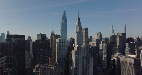 Aerial view of high rise buildings in midtown. One Vanderbilt and Chrysler building in afternoon sun. Manhattan, New York City, USA in 2021