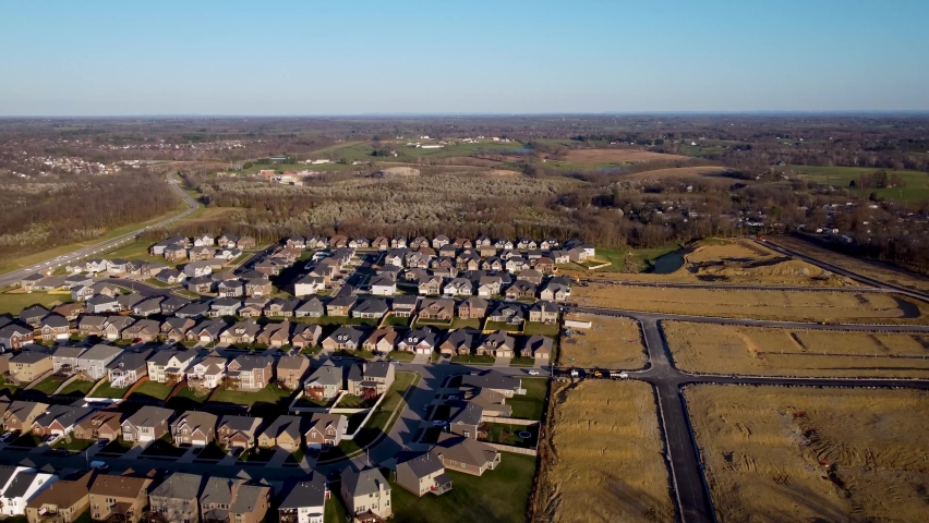 Starting from newly built neighborhood, gradually revealing the city of Lexington, KY with financial downtown district visible on the horizon