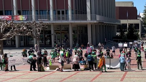 Berkeley, CA - April 9, 2022: 4K HD video of unidentified participants at Abortion Rights Rally with counter protestors stand on the other side of Sproul Plaza

